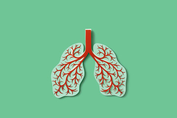 Handmade colored paper human lungs with inflamed bronchi