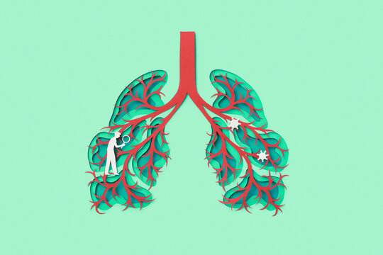 Paper man with magnifying glass examining bacteria in human lungs