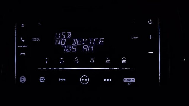  car dashboard audio in FM-receiver, CD, volume control knobs, switching between songs and other buttons to control music in the car. Luxury Car Sound Control Button Play and Pause. Interior of car 4K