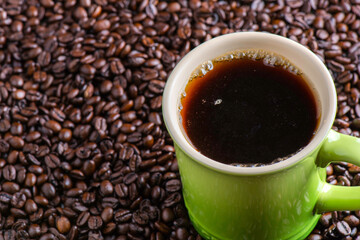 Coffee Bliss: 4K Ultra HD Image of Close-Up of Coffee Cup on Coffee Beans