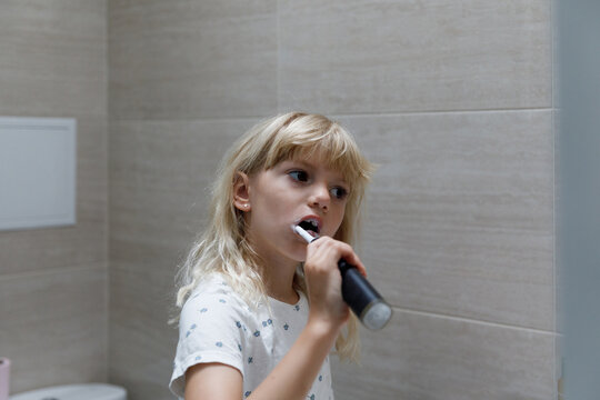 A little girl brushing teeth 