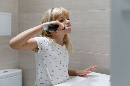 A little girl brushing teeth 