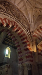 Columns supporting arches at the ceiling in the Mosque-Cathedral in Cordoba, Spain
