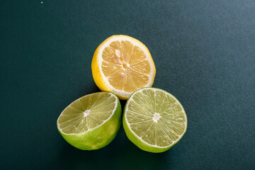 Vibrant Citrus: 4K Ultra HD Image of Fresh Cut Lemon Pieces on Green Background