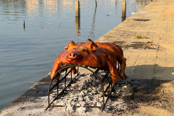 Grilled pork by a river in Vietnam