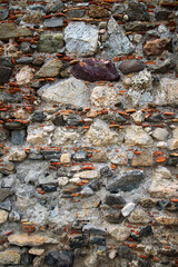 Abstract background, textured surface of an ancient wall. Stonework ruins.