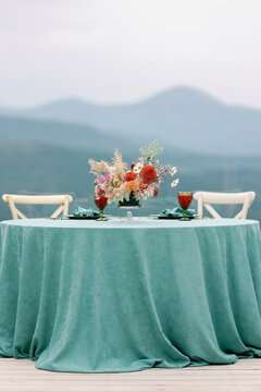 Outdoor dinner for two with hilltop panorama