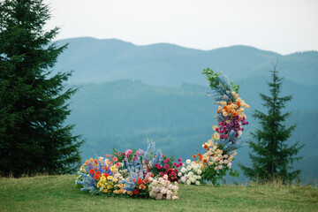 Floral bloom installation wedding alfresco mountain decor composition