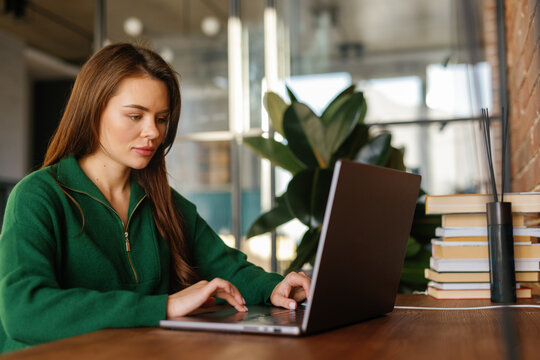 Young woman using laptop at home