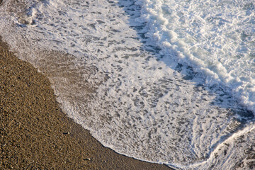 Serene Seascape: 4K Ultra HD Image of Wave on Sandy Beach with Lots of Copy Space