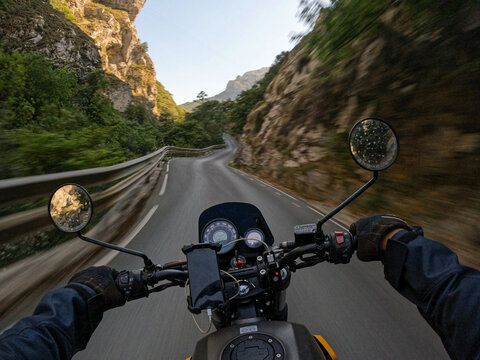 Pov ride on  curvy mountain road through a canyon