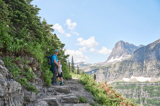 Father and son hiking the Highline Trail in Glacier National Park.