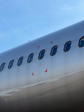 a row of windows on a metal colored plane
