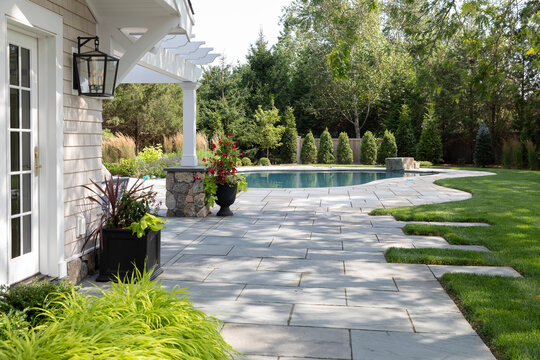 Residential luxury Home outdoor terrace patio to swimming pool 