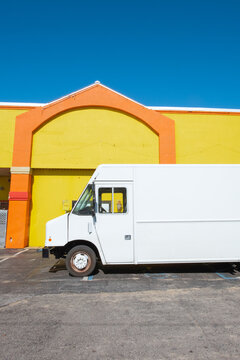 Delivery Truck Parked in Front of Store