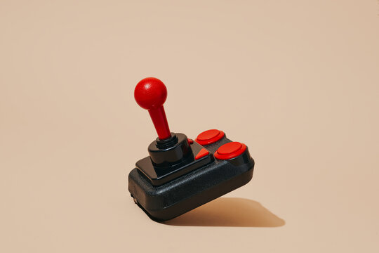 joystick on a pale pink background