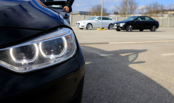 Photo of the front headlight of a premium car in a rental car that needs surface maintenance