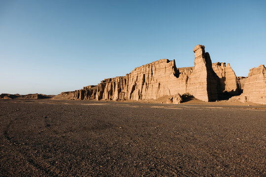 Desert Cliffs and Black Gravel Road