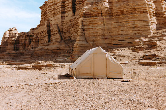 Desert Expedition Tent against Striated Rock Formations