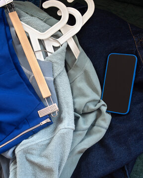 Clothing complements lying on a sofa