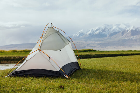 Riverside Camping with Snowy Mountain View
