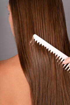 Long brown hair with a hair brush