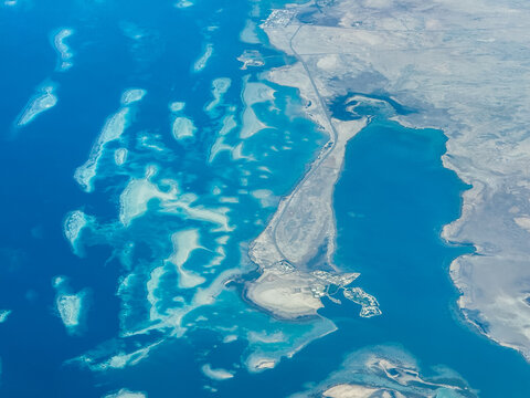 aerial landscape view of Aljazeera peninsula in Saudi Arabia, located at Red Sea coastline with turquoise water all around several small islands, near Thuwal in Mecca region 