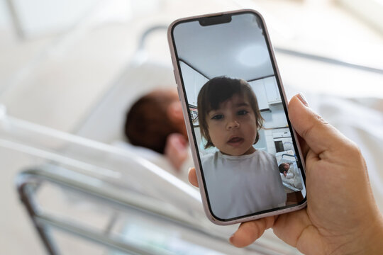 Video call of newborn baby at hospital.