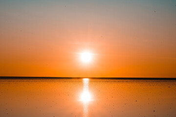 Magic orange sunset view.
A sunset is a natural phenomenon that occurs daily as the sun dips below the horizon, marking the end of daylight hours. It is a breathtaking and often picturesque event 