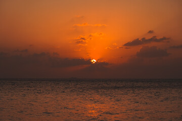 Magic orange sunset view.
A sunset is a natural phenomenon that occurs daily as the sun dips below the horizon, marking the end of daylight hours. It is a breathtaking and often picturesque event 