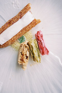 bitten eclair and macarons