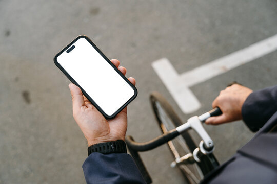 Mobile with a white screen in men's hands
