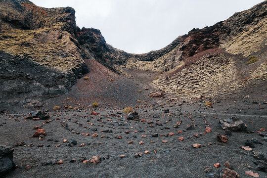 Labyrinth of stones on the ground inside the crater of a volcano