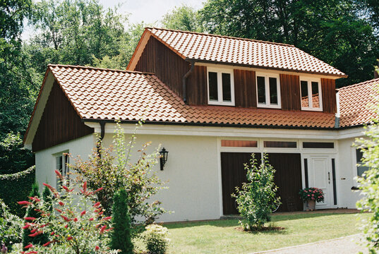 german house in summer with landscaping