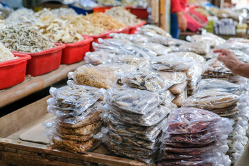 Fototapeta premium Salted fish or dried fish is fish that is preserved by salting and drying in the sun. It is being sold at fish markets. This is a famous traditional side dish in Indonesia.