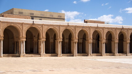 Inner courtyard surrounded by a patio supported by arches and columns in the Great Mosque of Kairouan, in Kairouan, Tunisia