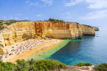 Picturesque Algarve coast in Portugal on a sunny day. Praia de Benagil beach on the Algarve,...