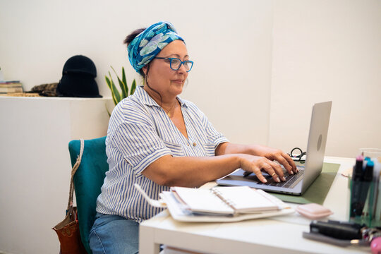 mature Plus-Size Woman Working on Home Business