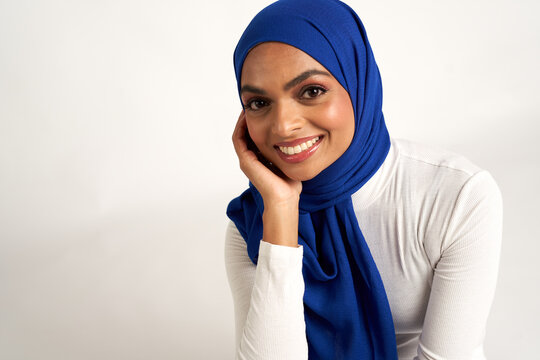 Muslim woman photographed against a seamless backdrop