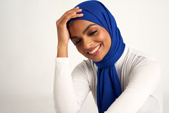 Muslim woman photographed against a seamless backdrop