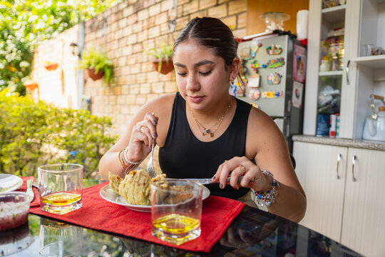 Woman eating Peruvian food