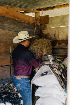 Unrecognizable person working on a farm.