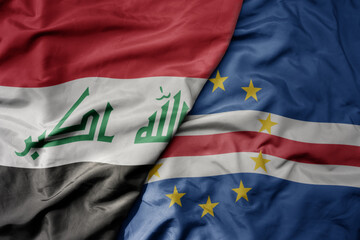Naklejka premium big waving national colorful flag of cape verde and national flag of iraq.