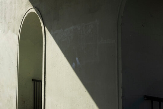 Photo of green tunnel with contractual shadow