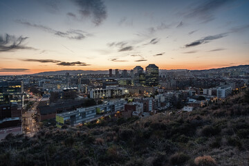 Twilight view of the south-western districts of the city of Barcelona in Spain.