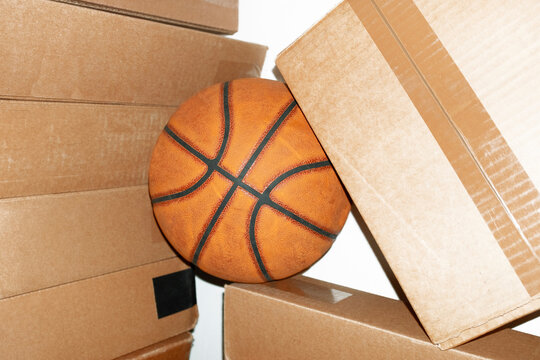 Contemporary style photo of basketball cardboard boxes and flashlight
