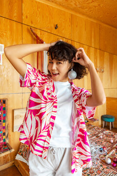 Young Asian woman with Christmas bauble