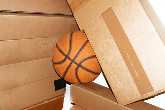 Contemporary style photo of basketball cardboard boxes and flashlight