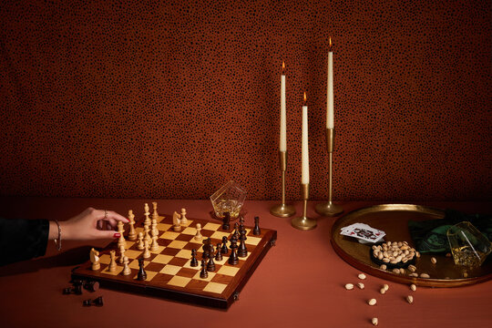Chess board and woman's hand