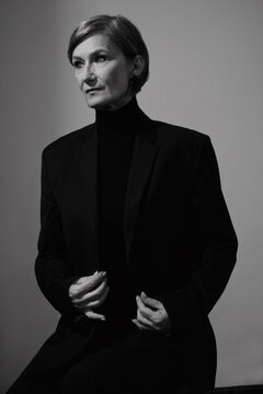 Middle aged woman in black jacket